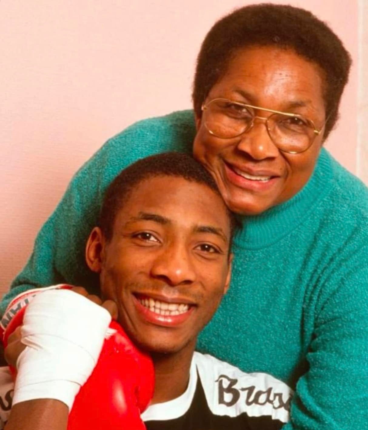 Johnny Nelson MBE with his mother Cynthia, both smiling warmly.